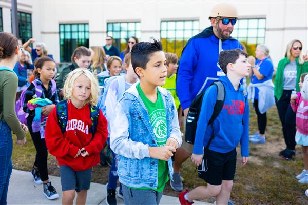 Students walking to school for National Walk to School Day.
